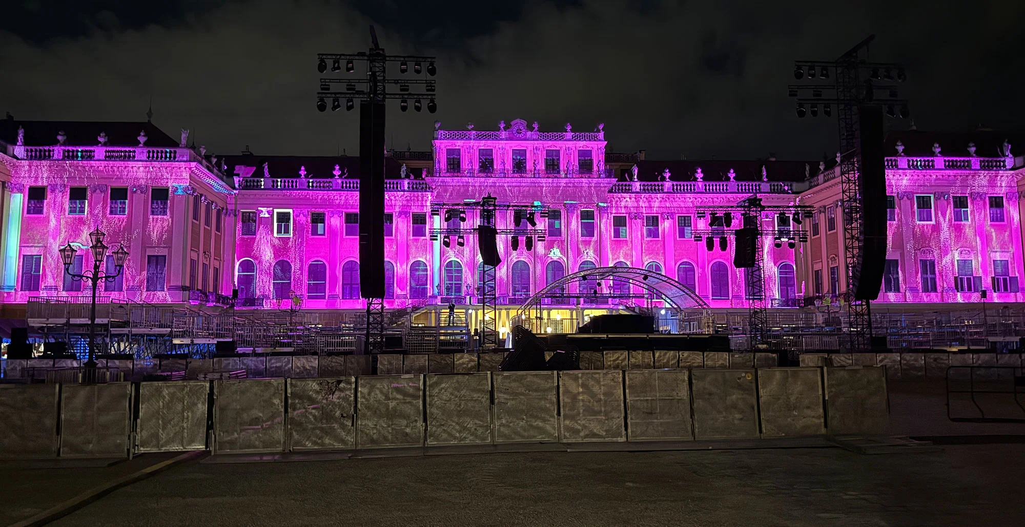 Pink visuals on the palace facade in front of the empty concert area